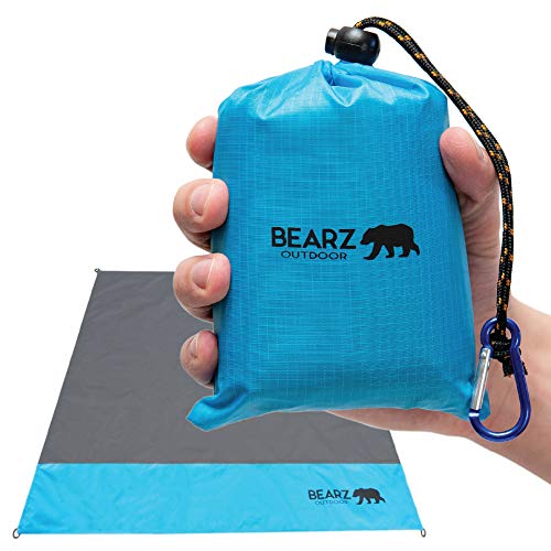 Someone holding a package of a pocket blanket