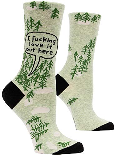 A pair of socks with a print of a forest and someone in the forest