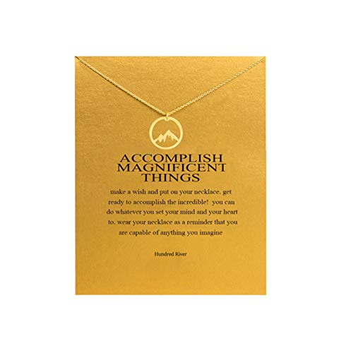 A golden necklace with a pendant of a mountain and a motivational quote