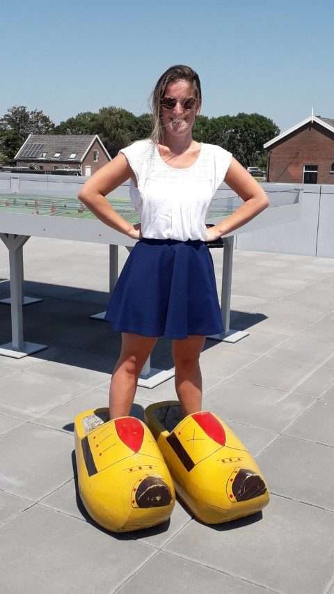 Woman standing in wooden shoes