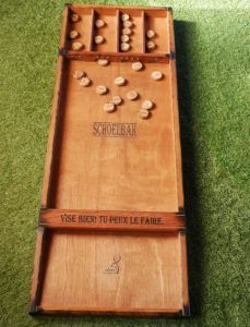 A wooden sjoelbak game from The Netherlands