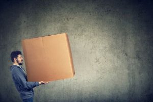 A man carrying a large box