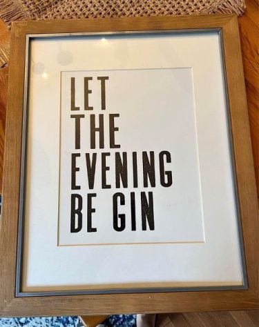 A framed poset with the text "let the evening be gin"