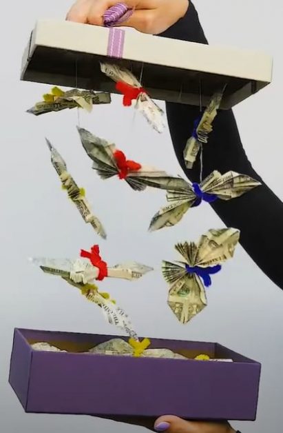 Box with butterfly origami hanging from the lid