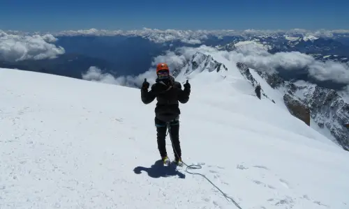 Woman at the top of mountain