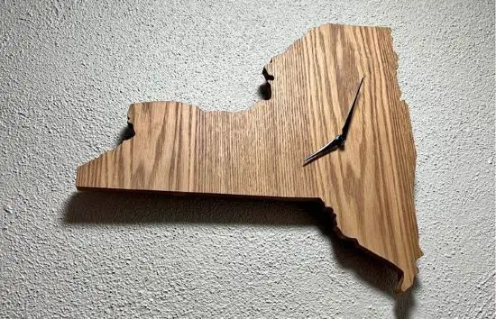 a wooden clock in the shape of New York State