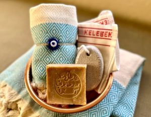 A hammon gift basket with a towel and soap