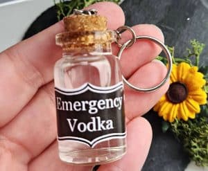 A keychain with a small bottle with the label 'Emergency vodka"